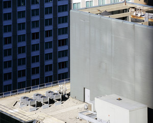 A view of NYC buildings and ac units on the roof