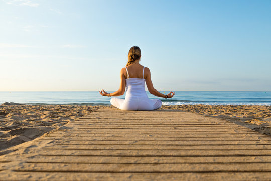 girl doing sport on the beach