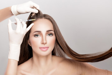 Cosmetic been injected in woman's head.