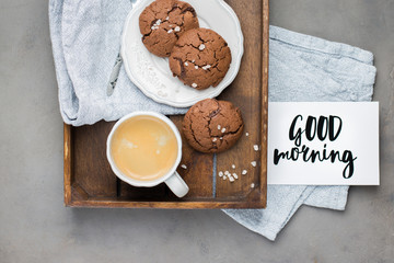 The perfect tasty breakfast!) Chocolate chip cookies with dark chocolate and sea pink Himalayan salt and cup of coffee on a gray concrete background. Best Brown Butter Cookies. 