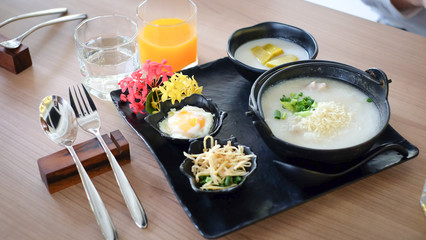Congee asian food breakfast set with orange juice