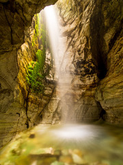 Fototapeta na wymiar Waterfall inside of a cave in Norway.