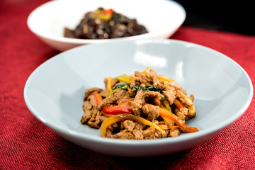 wok fried chicken stir fry with sweet peppers and chinese vegetables