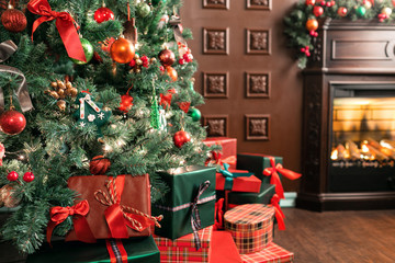 pile of Christmas gifts close-up under the Christmas tree. red and green presents