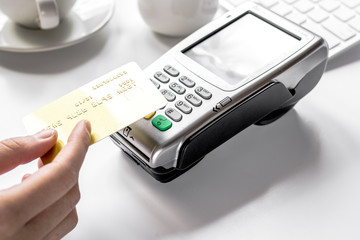 Payment by card in cafe with keyboard on white background