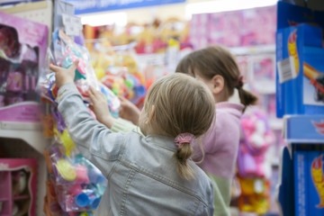 Two sisters in   toy store