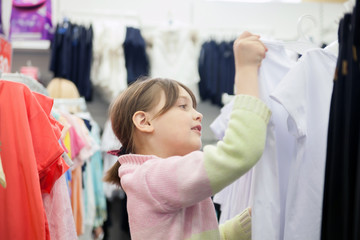  little girl choosing clothes