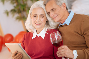 I fall for you every day. Harmonious couple smiling and embracing while spending some time together and relaxing at home.