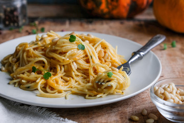 spaghetti with pumpkin sauce and pine nuts