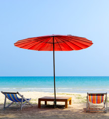 Beach chair and red umbrella on the beach ,Trat Province Thailand