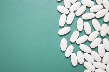 Heap of white pills on a white background, Healthcare and Medicin