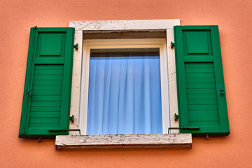 Naklejka na ściany i meble Old wooden window shutters of an mediterranean house,Italian Window with Open Wooden Shutters