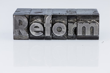 reform written in lead letters
