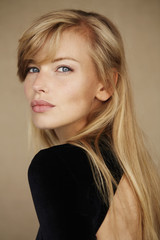 Glamorous blond in black fashion, portrait