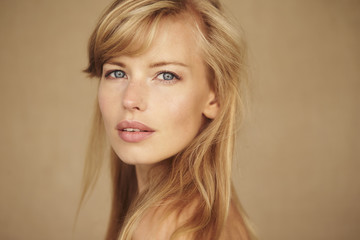 Fototapeta premium Blond and blue eyed beauty looking at camera