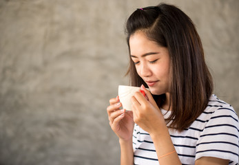 Portrait of asian girl drinking hot coffee