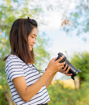 Portrait Of Asian Beautiful Girl Using Camera