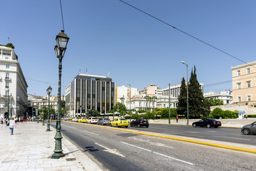 Fototapeta premium ATHENS, GREECE - May 3, 2017: Street view of modern buildings in Athens, Greece