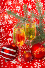 Fototapeta na wymiar glasses of champagne and Christmas decorations