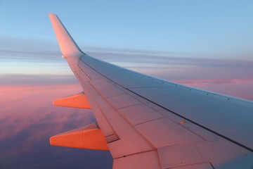 View from window on wing of plane in flight