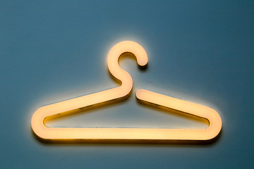 LED lit hanger on a blue changing room wall