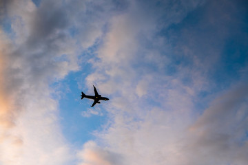Airplane in the sky, silhouette of a big airliner
