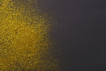 Golden glitter sand texture, abstract background.