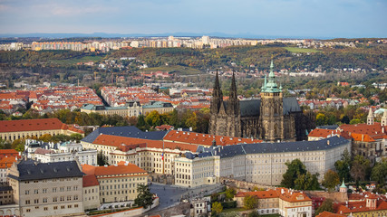Fototapeta na wymiar Aerial view of the Old Town architecture with red roofs in Prague , Czech Republic. St. Vitus Cathedral in Prague.