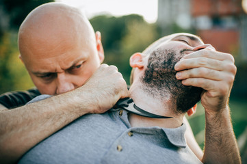 Knife threat. Kapap instructor demonstrates self defense knife threat disarming