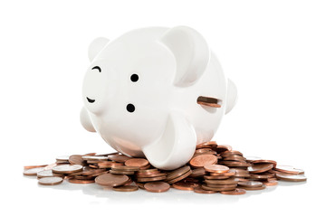 Coins falling from piggy bank
