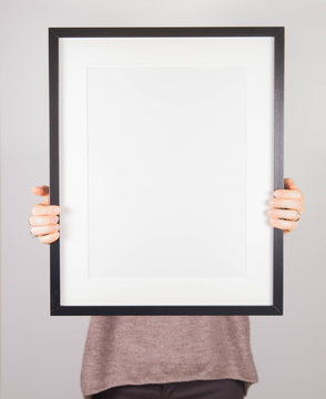 Woman's Holding A Blank Picture Frame