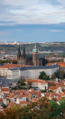 Fototapeta na wymiar Aerial view of the Old Town architecture with red roofs in Prague , Czech Republic. St. Vitus Cathedral in Prague.