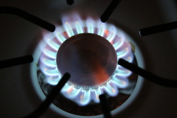 a gas burning stove that's lit