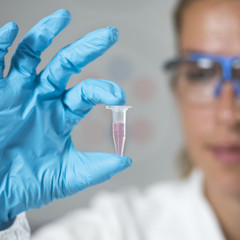 Female Researcher Holding a Micro Tube