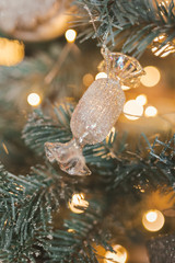 Decorated Christmas tree on blurred, sparkling and fairy background