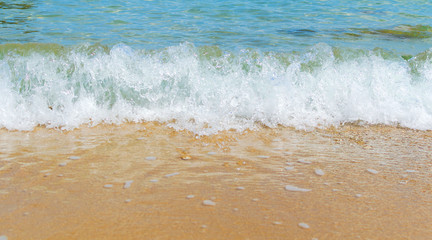 Soft Wave Of Blue Ocean On Sandy Beach. Background. Selective focus