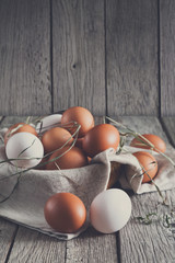 Fresh chicken brown eggs on rustic wood, organic farming concept