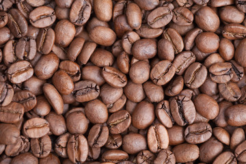 Roasted brown coffee beans as background, grade arabica