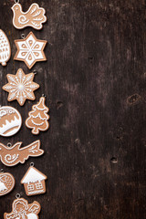 Christmas wooden background with gingerbread cookies