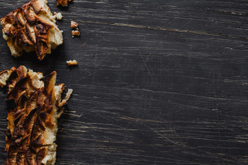 Piece of pie on rustic wooden table