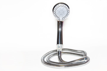 Shower faucet and metal shower hose on white background