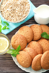 Composition with delicious oatmeal cookies on wooden background