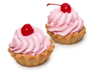 Pair of delicious cakes with cherry and creme isolated on white background, close up