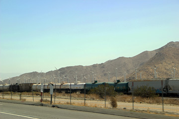 Freight Train Travels through Desert Area of New Mexico