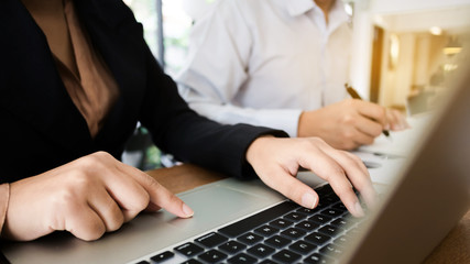 freelance financial inspecter working with digital documents valuation data at a work cafe