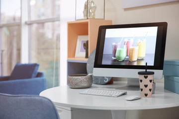 Comfortable workplace with monitor in interior of beautiful modern room