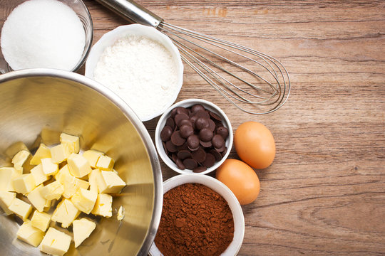 Bakery ingredients. Ingredient of brownie on wooden background. Top view with copy space.