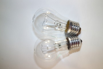 two incandescent lamps close-up on a white background