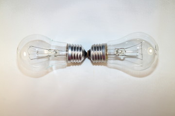 two incandescent lamps close-up on a white background