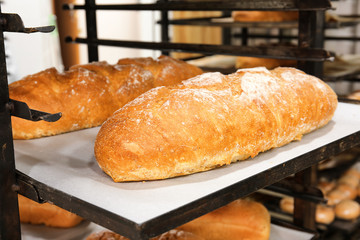 Loaves of bread on shelving in bakery
